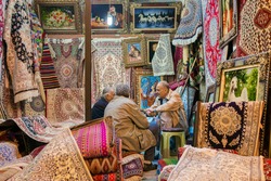 Shiraz, Iran - December 24, 2015: Traditional iranian carpets shop in Vakil Bazaar, Shiraz, Iran. Vakil Bazaar is the most important tourist attraction in Shiraz, Iran.