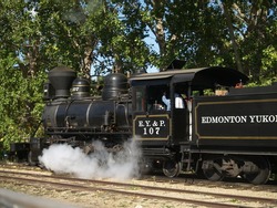 Steam is released in the drive stroke from a restored locomotive done up as an engine of the long defunct (1909) C Y & P Railroad