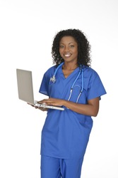 Beautiful African American woman doctor or nurse holding a laptop computer isolated on a white background