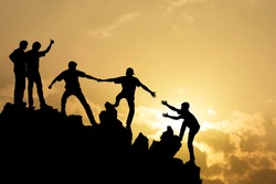 Group of people on peak mountain climbing helping team work , success business concept