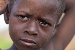 BURKINA FASO - AUGUST 9: Child Bissa ethnic posing, the Bissa represent 4% of the population of Burkina Faso, August 9, 2009 in Country Bissa, Burkina Faso