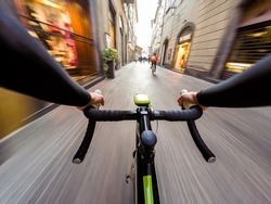 cyclist in traffic on the city roadway motion blur. POV Original point of view