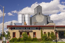 BOZEMAN, MONTANA, USA - AUGUST 2004: Montana Ale Works microbrewery, with grain elevators at rear.