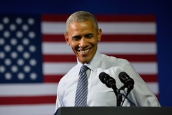 CHARLOTTE, NC, USA - JULY 5, 2016: President Barack Obama laughs as he delivers a speech at a rally for the presumptive democratic nominee at the Charlotte Convention Center.