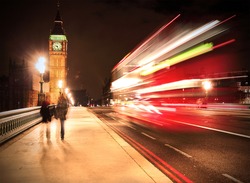 Westminster Bridge in London at night with Big Ben and bus