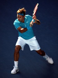 MELBOURNE - JANUARY 27: Roger Federer during his win over Nikolay Davydenko during a quarter final match in the 2010 Australian Open on January 27, 2010 in Melbourne