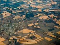 Aerial view of fertile farmlands Surrounding Urbane Sprawl of the City of Bisbane in Queensland Australia