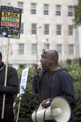 London, United Kingdom - September 23, 2016: Black Lives Matter in Britain. A small rally in London outside the American Embassy to support the movement Black Lives Matter.