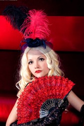 Girl in the clothes of past years in style Cabaret Moulin Rouge