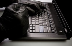 Security concept with mad hacker working on laptop at night, internet crime