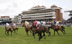 NEWBURY, BERKS - MAR 27: Jockeys race to the finish in the 2nd race at Newbury Racecourse, UK, March 27, 2010 in Newbury, Berks