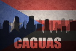 abstract silhouette of the city with text Caguas at the vintage puerto rican flag background