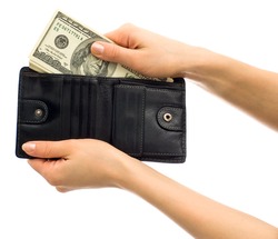 Dollars in black leather wallet isolated on white background