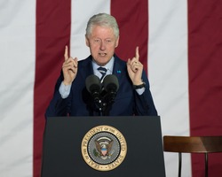 PHILADELPHIA, PA - NOVEMBER 7, 2016: Bill Clinton former US president gestures fingers pointed up as he delivers a speech at a campaign rally for Hillary Clinton the Democratic Presidential nominee.