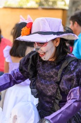 OAXACA, MEXICO - OCT 31, 2016: Unidentified woman painted for the Day of the Dead (Dia de los Muertos), national Mexican holiday, UNESCO Intangible Cultural Heritage of Humanity