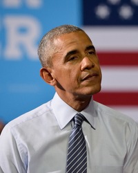 CHARLOTTE, NC, USA - JULY 5, 2016: President Barack Obama is seated on stage as he listens to a speech by Democratic Presidential nominee Hillary Clinton at the Charlotte Convention Center.