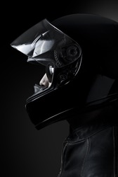 Mysterious biker in a dark environment, Clipping path included.