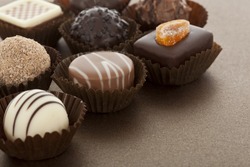 Assorted gourmet chocolate bonbons in paper cups