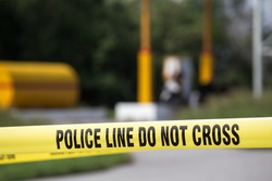 police line do no cross with gas station background in crime scene investigation training with copy space