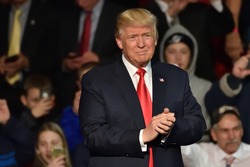 HERSHEY, PA - DECEMBER 15, 2016: President-Elect Donald Trump arrives on stage to deliver a speech at a Thank You tour rally held at the Giant Center.