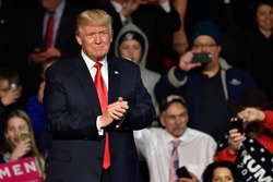 HERSHEY, PA - DECEMBER 15, 2016: President-Elect Donald Trump arrives on stage to deliver a speech at a Thank You tour rally held at the Giant Center.