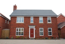 detached and typical british residential house with small entrance garden (isolated on white)