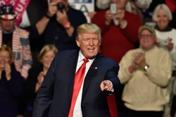 HERSHEY, PA - DECEMBER 15, 2016: President-Elect Donald Trump points straight toward the crowd as he concludes his speech at a "Thank You Tour" rally held at the Giant Center.