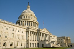 The eastern facade of the US Capitol Building, shortly after dawn. The entrance to the Senate is on the right.