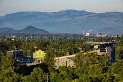 June 16, 2016. Eugene, Oregon, USA. The famous Autzen Stadium, where it never rains, stands amidst a veritable forest of green trees in the lush Willamette Valley