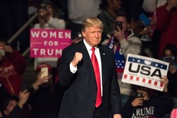 HERSHEY, PA - DECEMBER 15, 2016: President-Elect Donald Trump gives a "Fist Pump" as the confidently arrives on stage to deliver a speech at the "Thank You" Tour rally at the Giant Center.