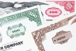 Corporate investing. Old stock share certificates from 1950s-1970s (United States). Vintage scripophily objects.