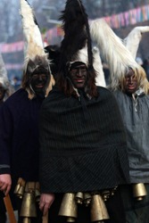PERNIK, BULGARIA - JANUARY 29, 2017 - Masquerade festival Surva in Pernik, Bulgaria. People with mask called Kukeri dance and perform to scare the evil spirits.
