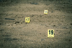 group of evidence marker number in crime scene investigation in cinematic tone