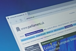 SARANSK, RUSSIA - FEBRUARY 15, 2017: A computer screen shows details of Parliament of the United Kingdom Exiting the European Union Committee page on its web site. Selective focus.