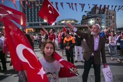 Istanbul - Turkey July 26,2016 People wave Turkish flags during a rally to protest the failed coup attempt at 15th July 2016 on Taksim Square.