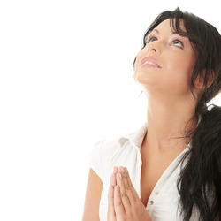 Closeup portrait of a young caucasian woman praying isolated on white background