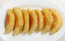 A view from above of cheese-stuffed traditional Ramadan qatayef pancakes. The Arab treat is made only during the holy month and consists of pancakes folded in half over a sweet filling and fried