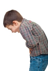 Child standing in profile having a severe stomach ache and screaming isolated on white background