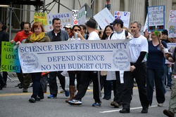 New York, New York. - April 15, 2017: People carrying signs at the March for Science in Manhattan in 2017 in New York City.