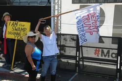 LOS ANGELES California- May 1, 2017: People Wave Signs, Wear Costumes, Yell, Demand Change at a Protest Rally Against President Donald J. Trump at a May Day Protest in Los Angeles, California