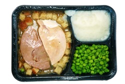 Classic Turkey and Stuffing "TV Dinner" in its black plastic tray, isolated on white with room for your text
