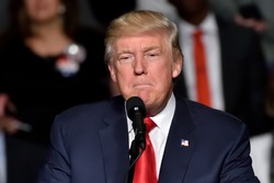 HERSHEY, PA - DECEMBER 15, 2016: Pensive President Donald Trump pauses during a campaign rally speech held at the Giant Center billed as the "Thank You" tour.