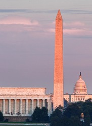 Lincoln Memorial, Washington Monument and Capitol building aligned as the sun starts to set in the fall