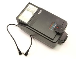 An old external hotshoe flash for a single lens reflex camera, SLR.