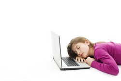 Picture of a cute teenage girl sleeping on her laptop computer, isolated on white background