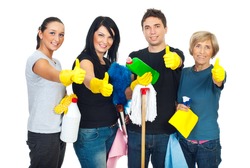 Successful cleaning people teamwork giving thumbs up and holding products for clean house