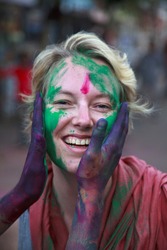 People at the holi festival in India. Holi, or Holli,is a spring festival celebrated by Hindus, Sikhs and others. People throwing coloured powder and coloured water at each other.