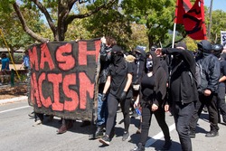 Berkeley, CA - August 27, 2017: Unidentified participants at the NO TO MARXISM IN AMERICA rally in Martin Luther King Jr. Civic Center Park, more counter-protesters than protesters.