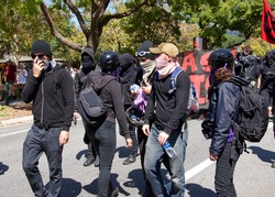 Berkeley, CA - August 27, 2017: Unidentified participants at the NO TO MARXISM IN AMERICA rally in Martin Luther King Jr. Civic Center Park, more counter-protesters than protesters.
