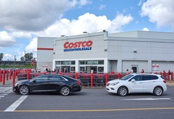 MONTREAL, CANADA - AUGUST 25, 2016 : Costco Wholesale store and logo. Costco Wholesale Corporation trading as Costco, is the largest American membership-only warehouse club